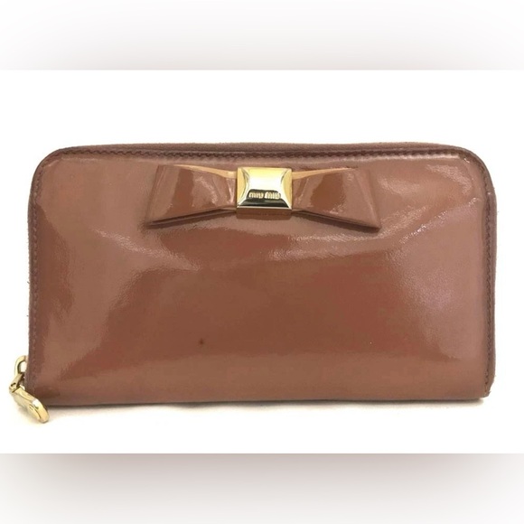 Miu Miu Handbags - Miu Miu Tan Patent Leather Clutch with Bow Accent